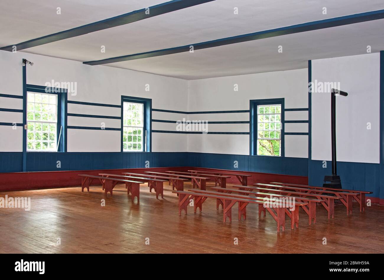 meeting room, unadorned walls, antique wood benches, wainscoting, old, Meeting House, 1820, Shaker Village of Pleasant Hill, defunct religious communi Stock Photo