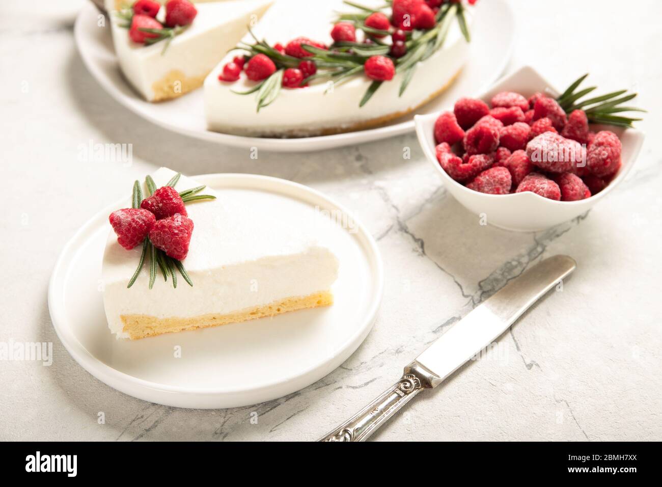 Plate with delicious raspberry cheesecake. On a wooden background Stock Photo