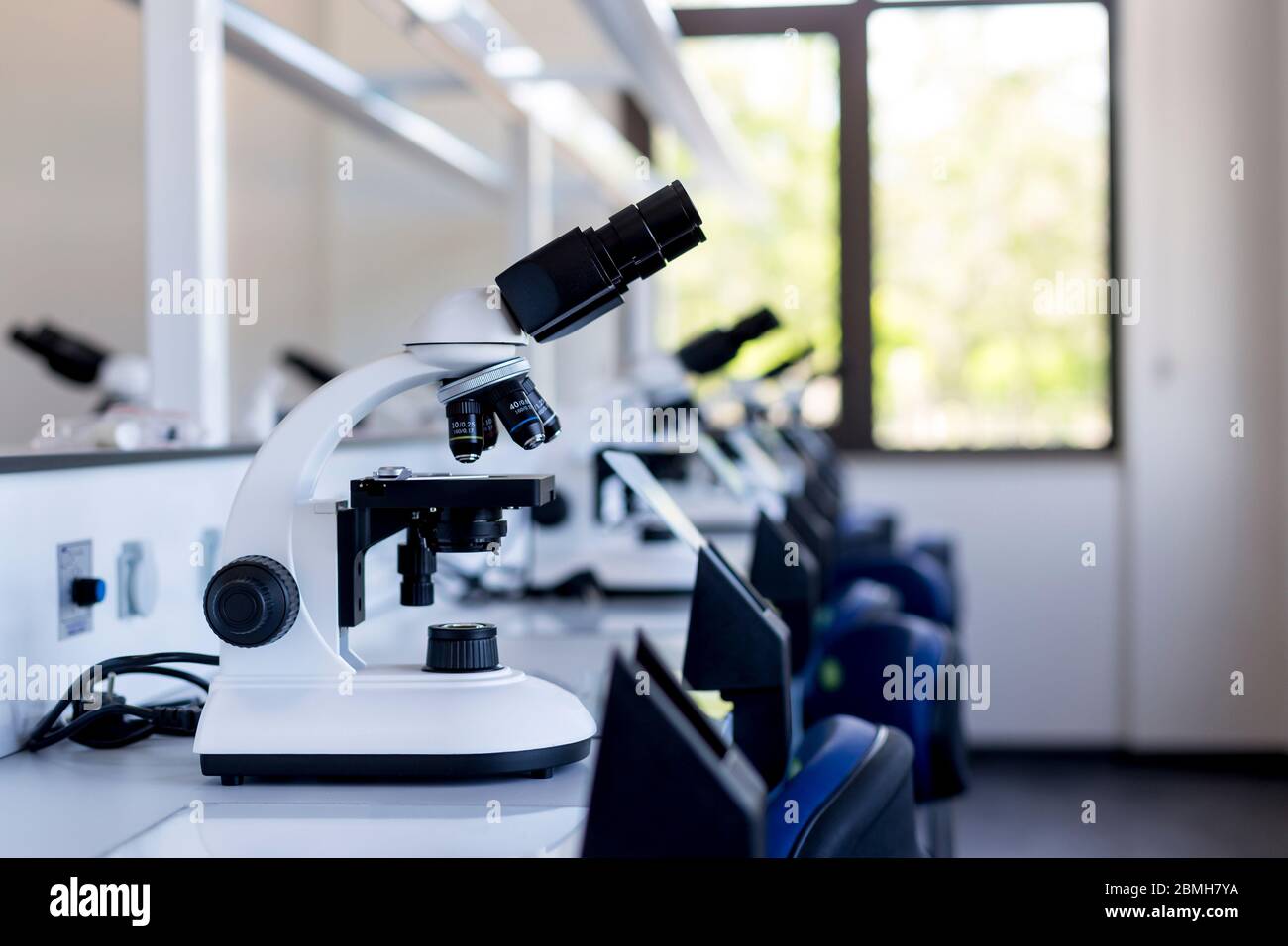 4-lens microscope in a laboratory Stock Photo