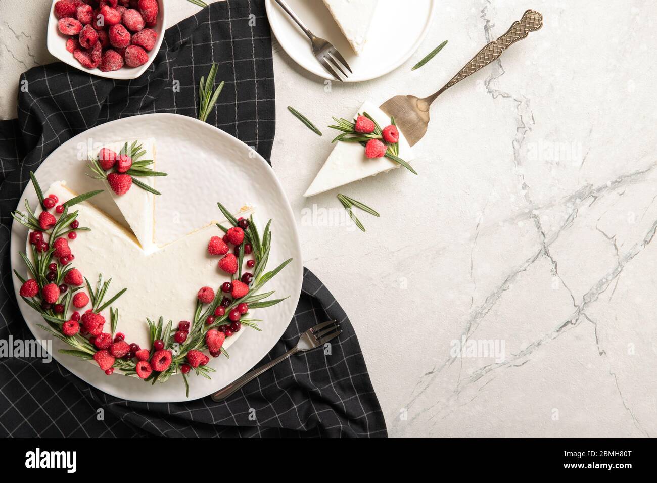 Plate with delicious raspberry cheesecake. On a wooden background Stock Photo