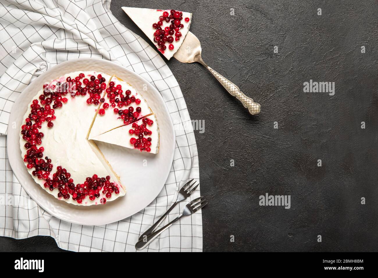 Plate with delicious cheesecake and fresh berries on the table Stock Photo
