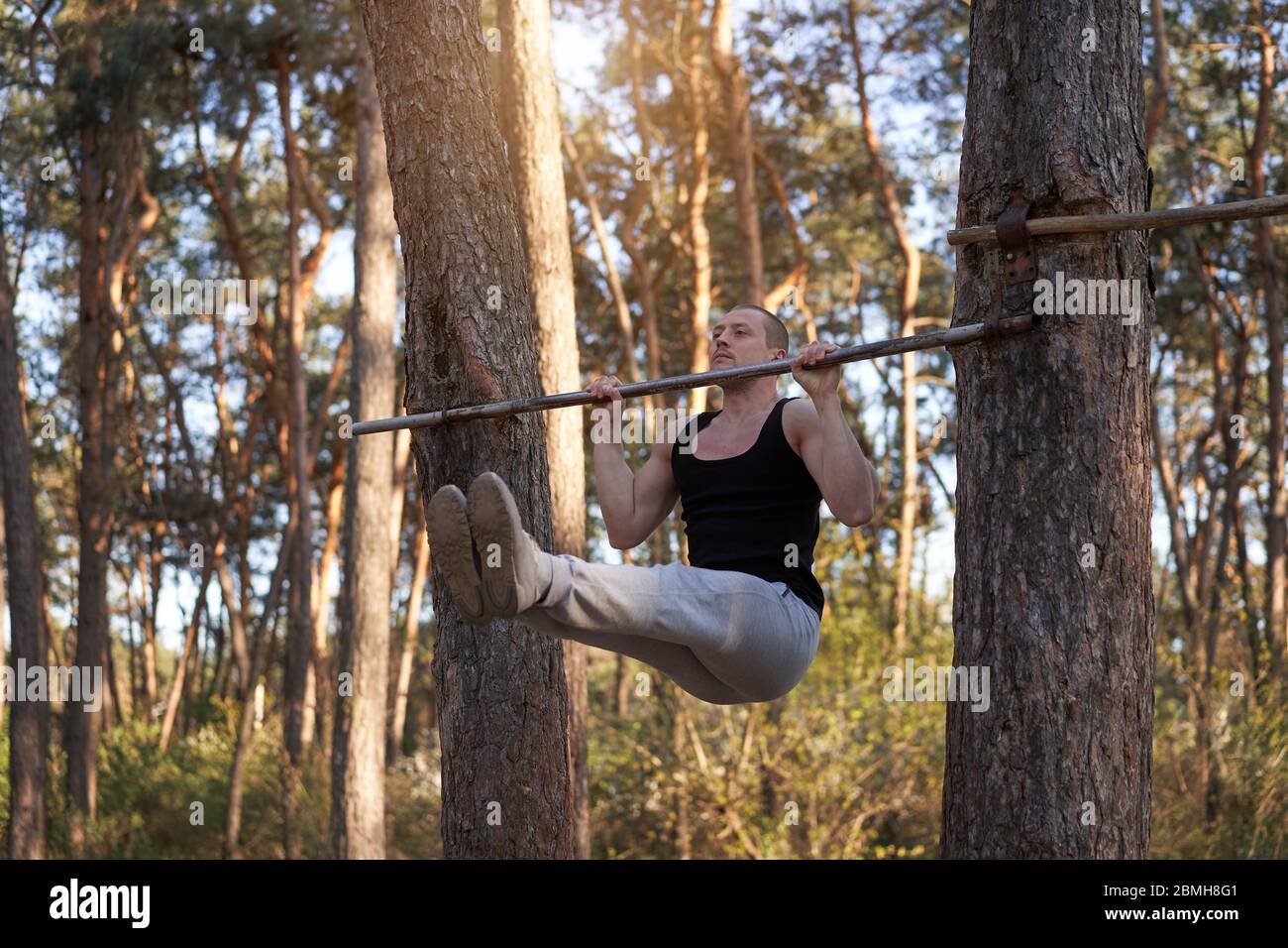 Handsome caucasian men pull-up outdoor workout cross training morning  Pumping arm abdominal exercising sports ground nature forest Healthy  lifestyle Stock Photo - Alamy