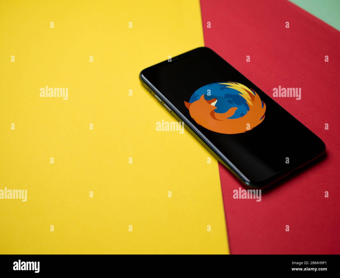 USA - May, 2020 Mozilla Firefox Iphone Application Screen on colored paper background. Stock Photo