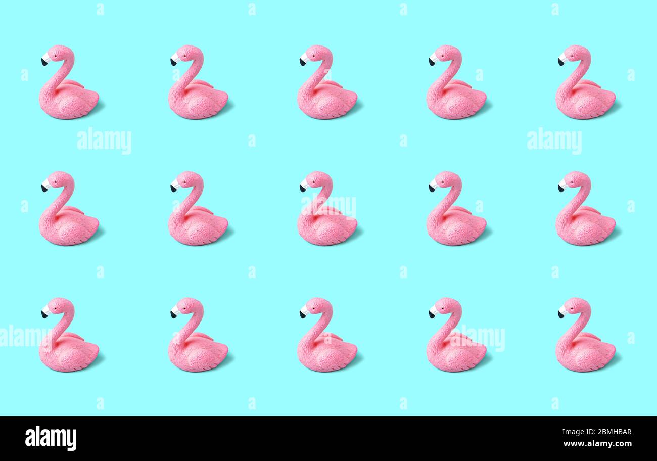 Pink flamingo seamless pattern on light blue background Stock Photo - Alamy