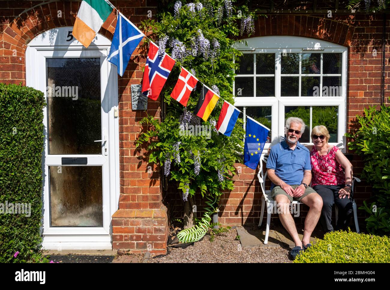 English couple celebrating Europe Day in self isolation due to the Coronavirus lockdown 2020 Stock Photo