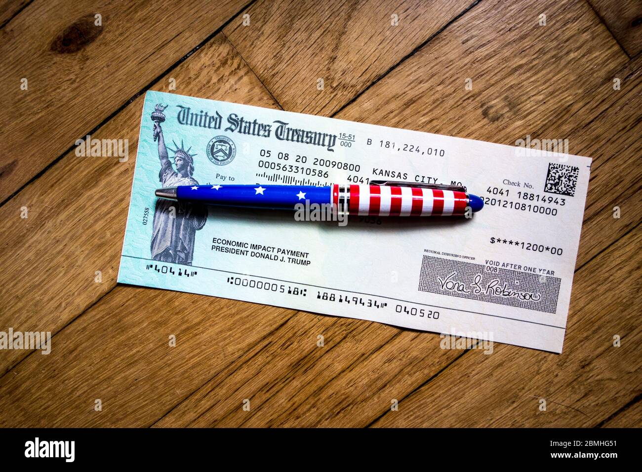 US Treasury $1,200 stimulus check to an individual as part of the Coronavirus Aid Relief and Economic Security Act, CARES Act Stock Photo
