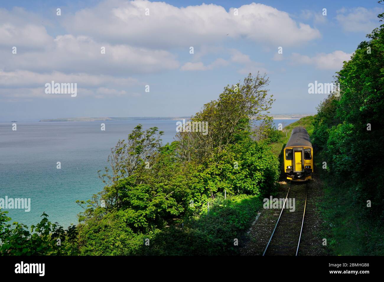 Primrose Valley Railway, single track. Train approaching St. Ives station. Stock Photo