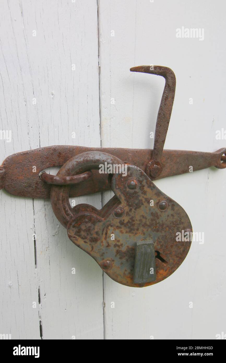 The vintage lock on the white door Stock Photo - Alamy