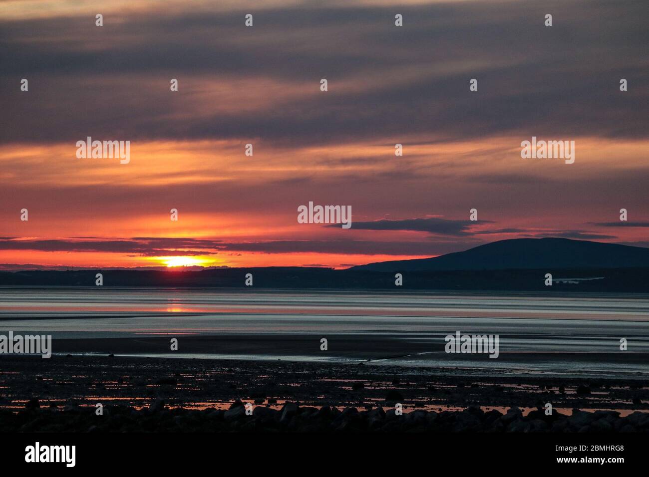 Morecambe, Lancashire, United Kingdom. 9th May, 2020. Sunset over Morecambe Bay will bring to an end the warm weather ahead of a forecast cold spell. Credit: Photographing_North/Alamy Live News Stock Photo