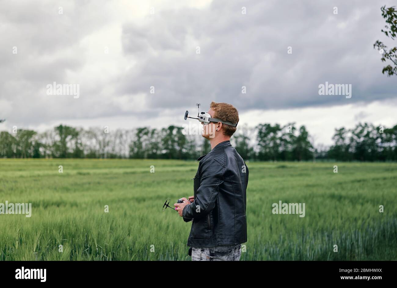 a man controls drone on the street Stock Photo