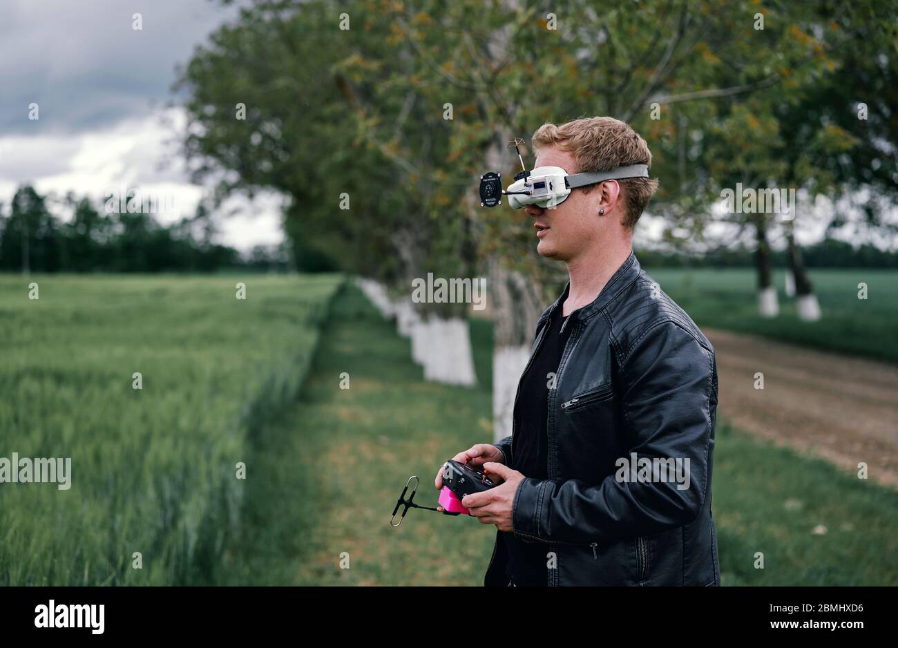 a man controls drone on the street Stock Photo