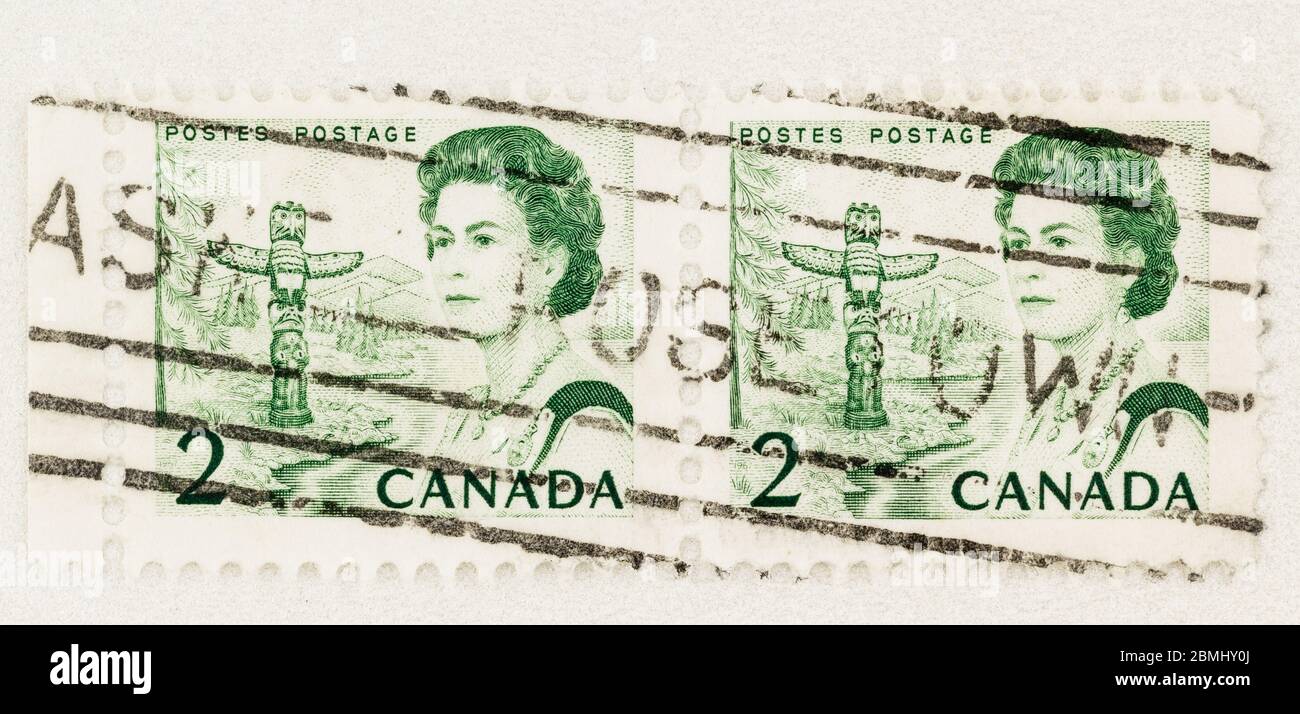 SEATTLE WASHINGTON - May 8, 2020: Engraved 1967 Queen Elizabeth green definitive stamp featuring Pacific Totem Pole.  Scott # 455 Stock Photo