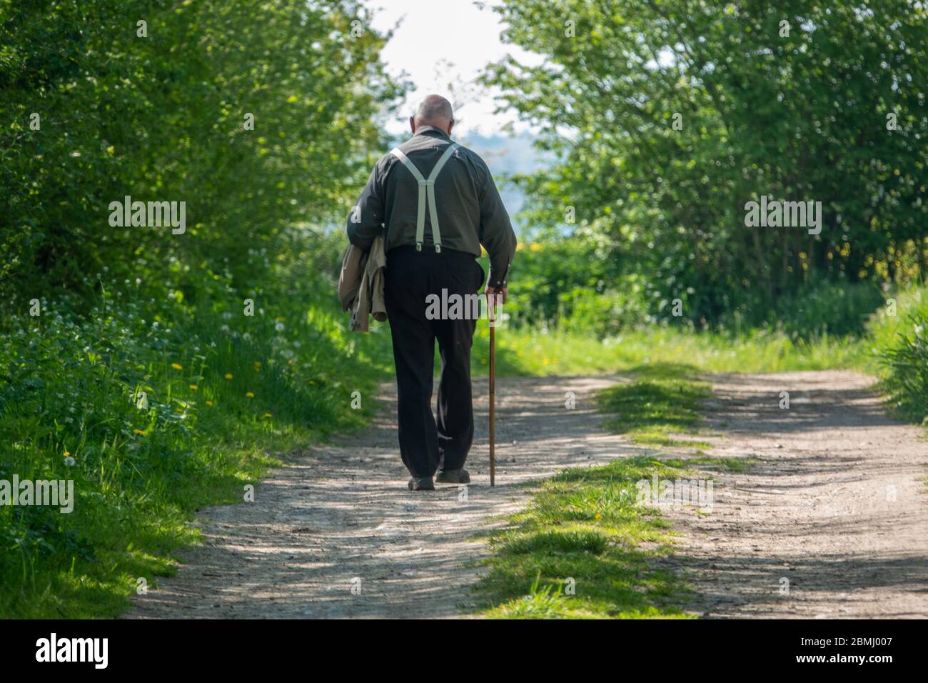 Senior man walking along country hi-res stock photography and images ...