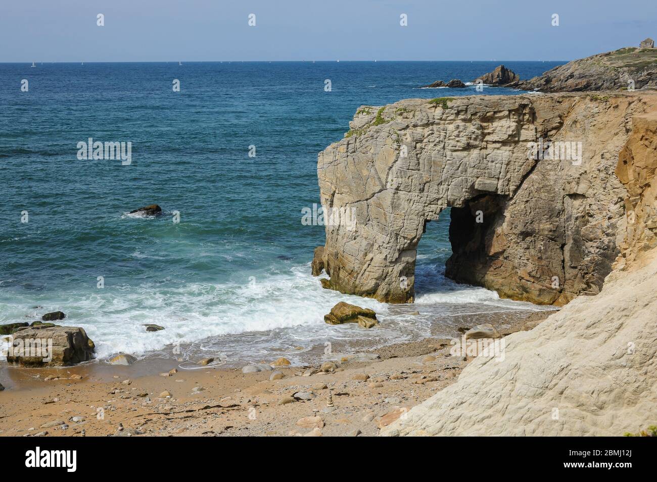 Natural stone arch L'Arche de Port-Blanc in Saint-Pierre-Quiberon (France), sunny calm day in summer Stock Photo