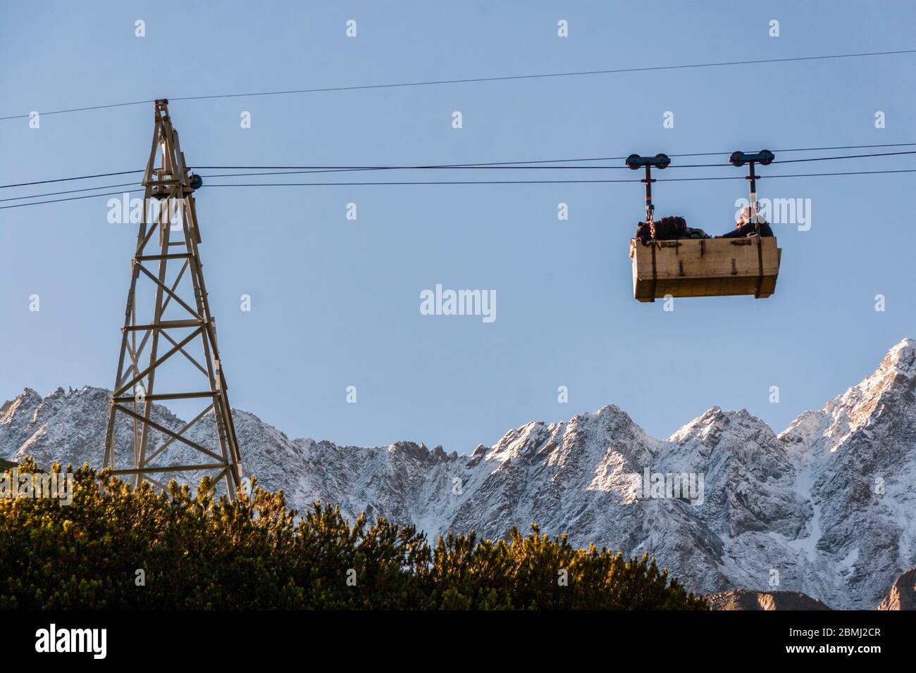 Freight cableway is used for patient transport after mountain accident Stock Photo