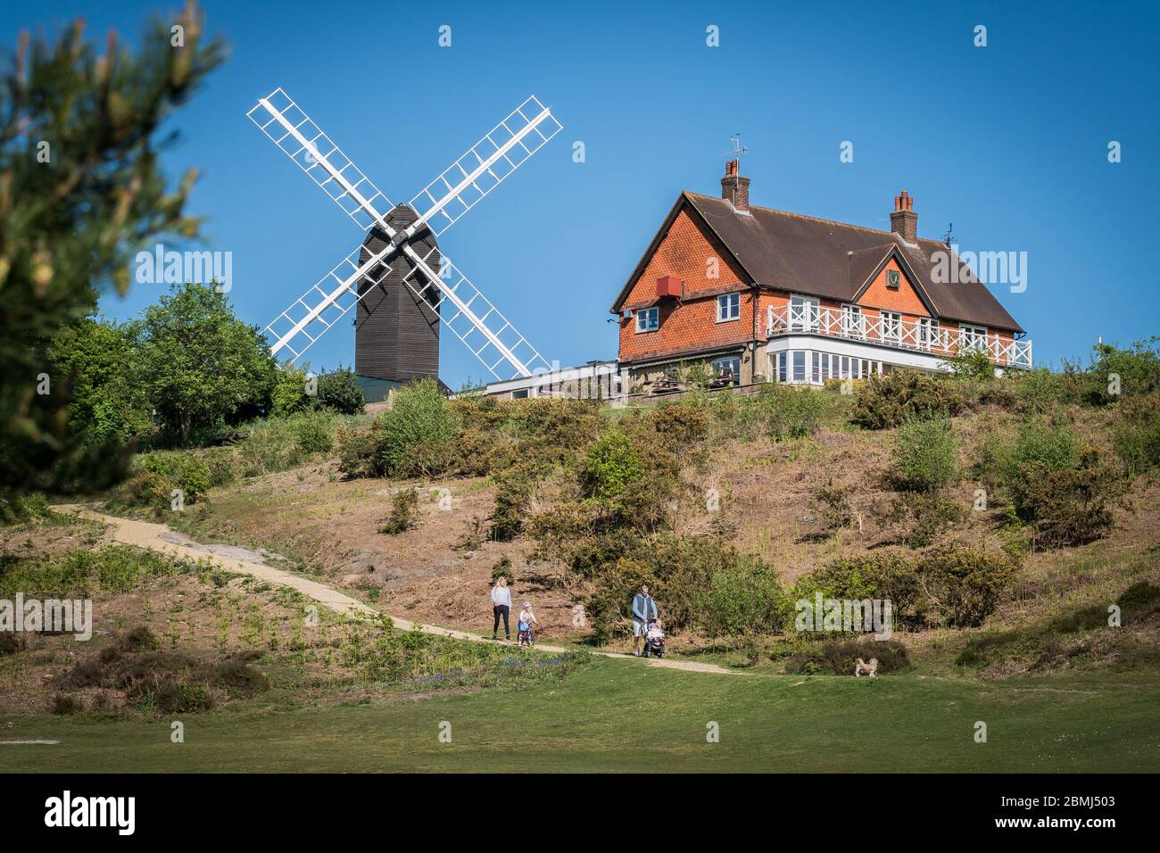Reigate, Surrey, UK - May 5, 2020 - 18th century windmill, now occupied by Reigate Heath Golf Club Stock Photo