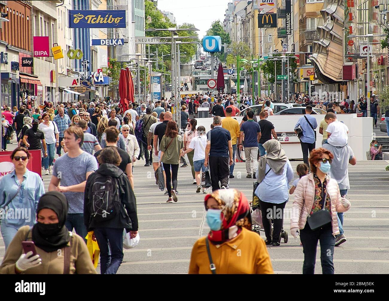 Vienna, Austria. 9th May, 2020. People are seen on a shopping street in Vienna, Austria, on May 9, 2020. Austria has gradually eased its restrictions after a nearly two-month lockdown to fight the coronavirus. So far, all shop have reopened with the measures that keeping a safe distance, wearing masks and so on while shopping. Credit: Georges Schneider/Xinhua/Alamy Live News Stock Photo
