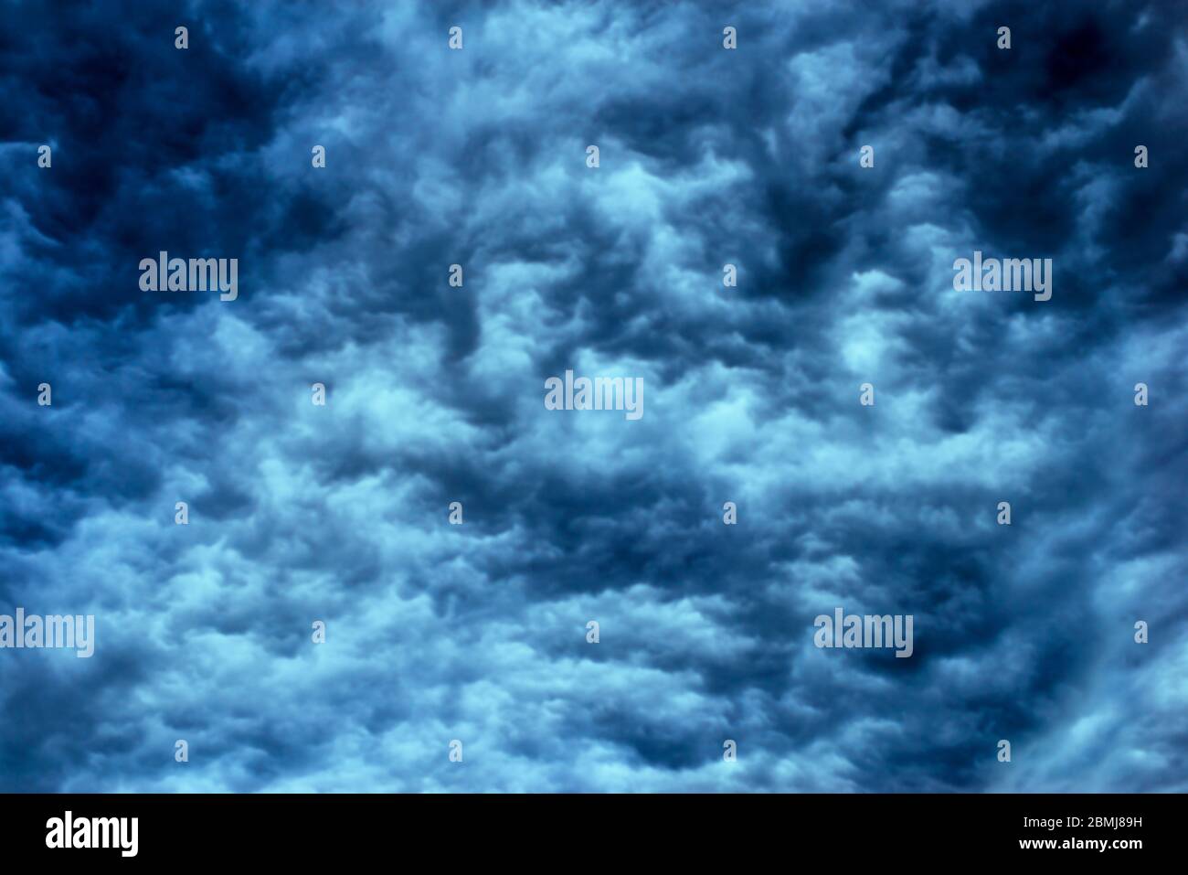Background Texture of dark ominous storm clouds. Stock Photo