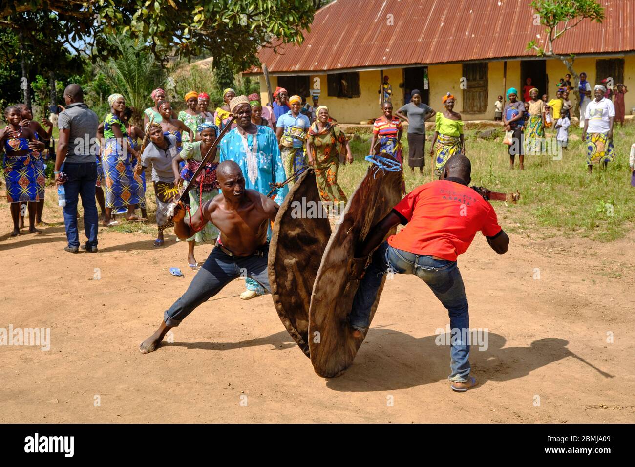 Two Rural Old Men Rivals Fighting Men participating in a simulated fight with old swords and shields ...