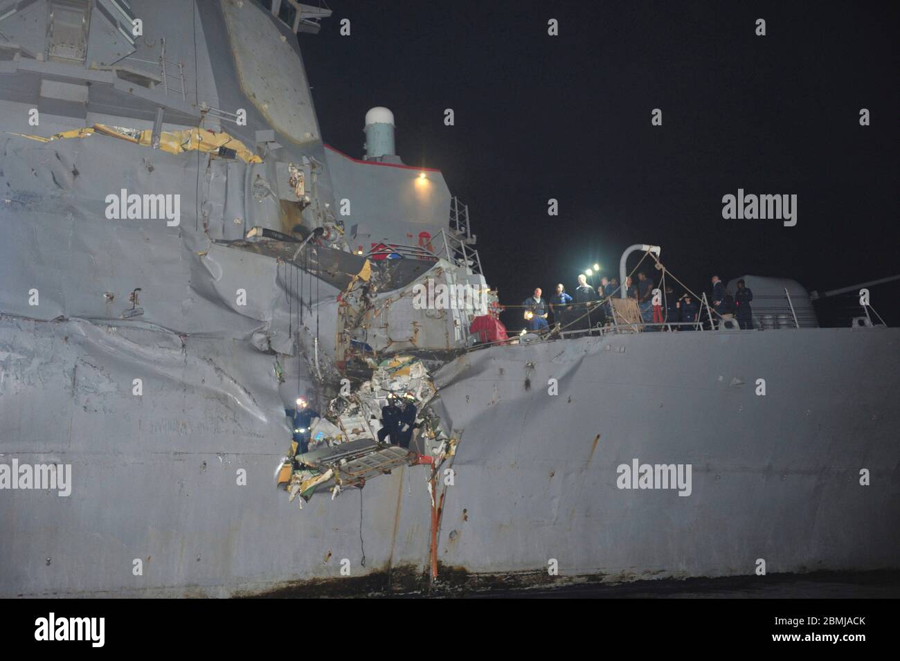Damage alongside the starboard mid-section of the U.S. Navy Arleigh Burke-Class guided-missile destroyer USS Porter following a collision with a Japanese owned bulk oil tanker M/V Otowasan August 12, 2012 in the Strait of Hormuz. No personnel on either vessel were reported injured in the accident. Stock Photo