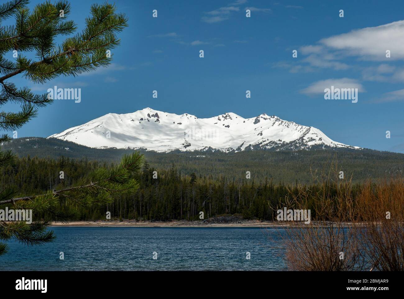 Oregon's Diamond Peak, a shield volcano, rises above Crescent Lake in