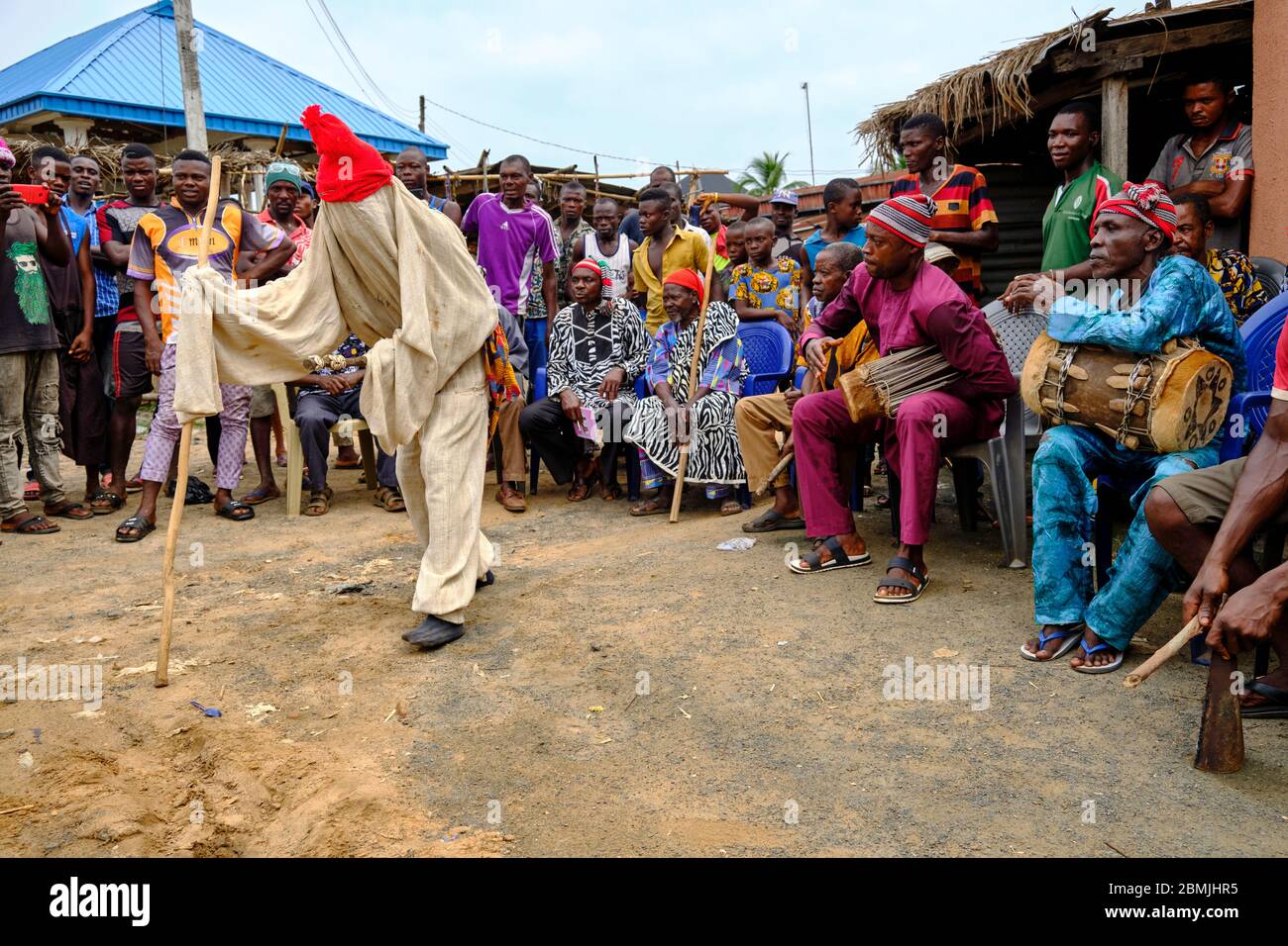 Person dressed in a traditional ceremonial costume during the celebration of an Igbo ritual. According to tradition, this type of masquerade is used t Stock Photo