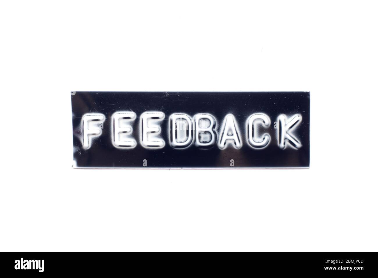 Embossed letter in word feedback in black banner on white background