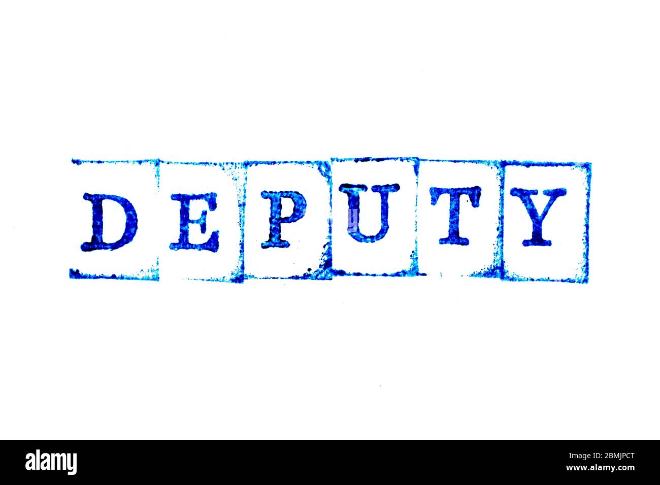 Blue ink of rubber stamp in word deputy on white paper background Stock Photo