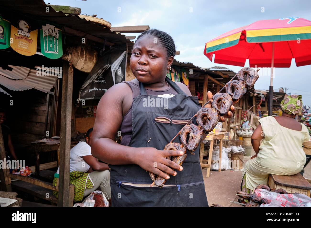 Woman selling dried fish at the Benin City market Stock Photo - Alamy