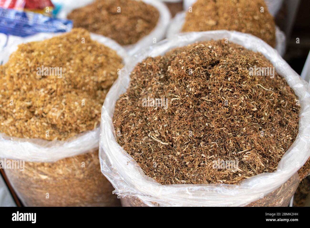 Dried tobacco sold in bags in the street. Photographed in Turkey. Various  tobaccos side by side. Close up Stock Photo