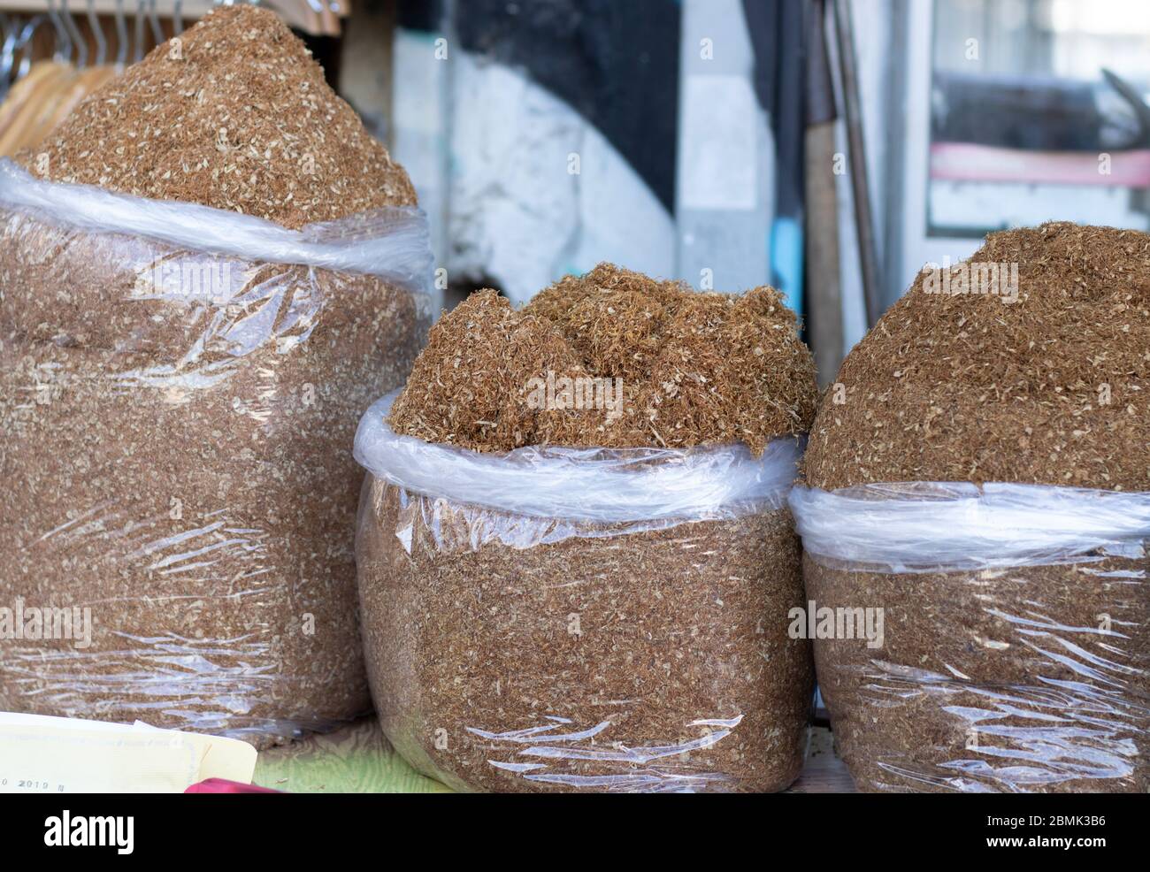 what tobacco is sold in turkey Dried tobacco sold in bags in the street. Photographed in Turkey. Various  tobaccos side by side. Close up Stock Photo