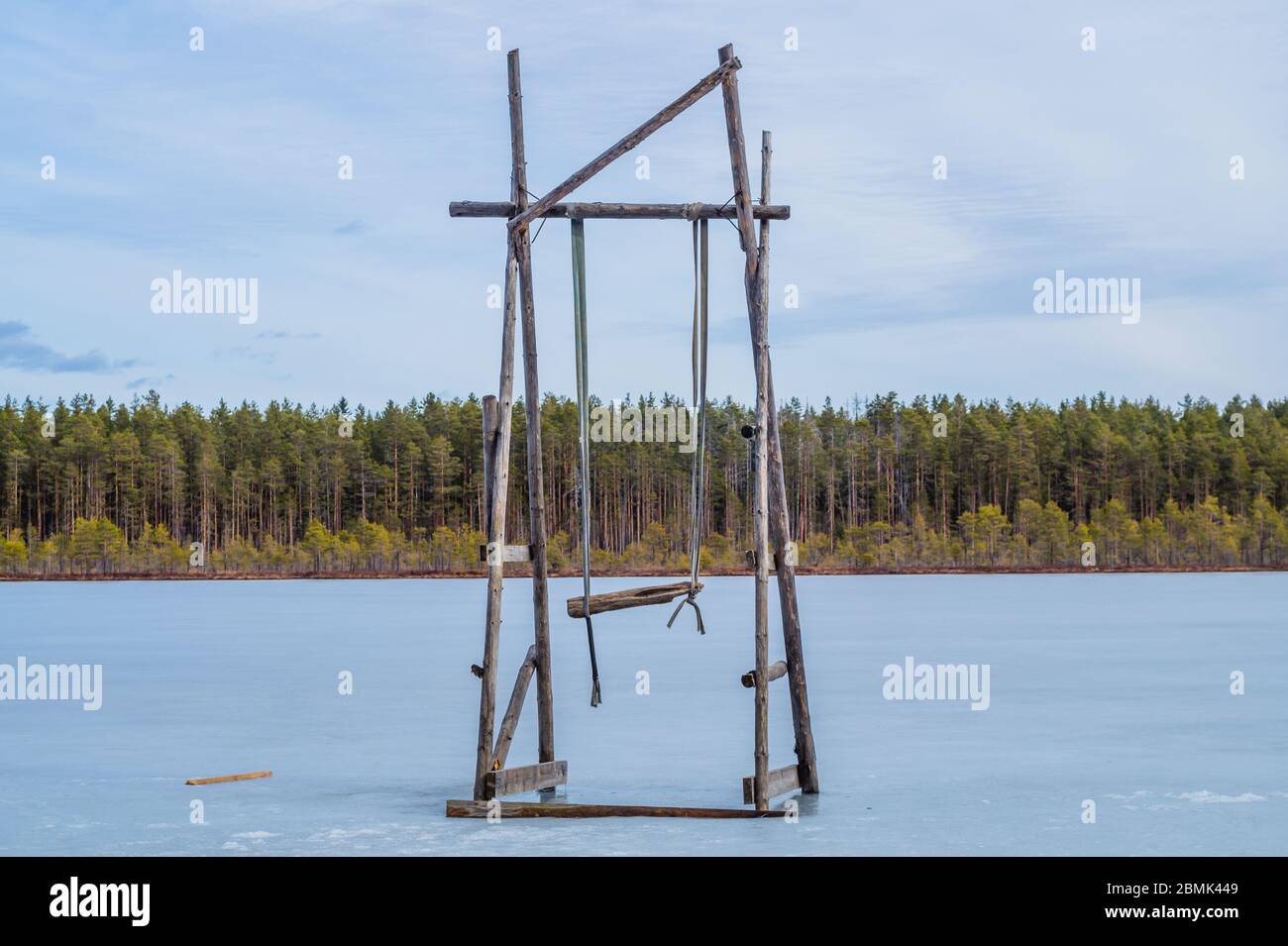 Wooden swing on a frozen lake. solitude concept. nature landscape Stock Photo