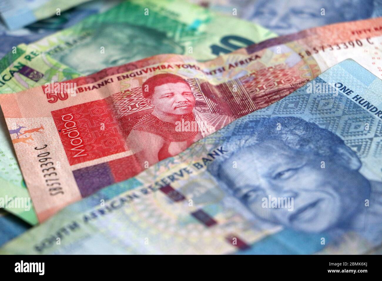 south-african-currency-money-rands-notes-scattered-on-white-background