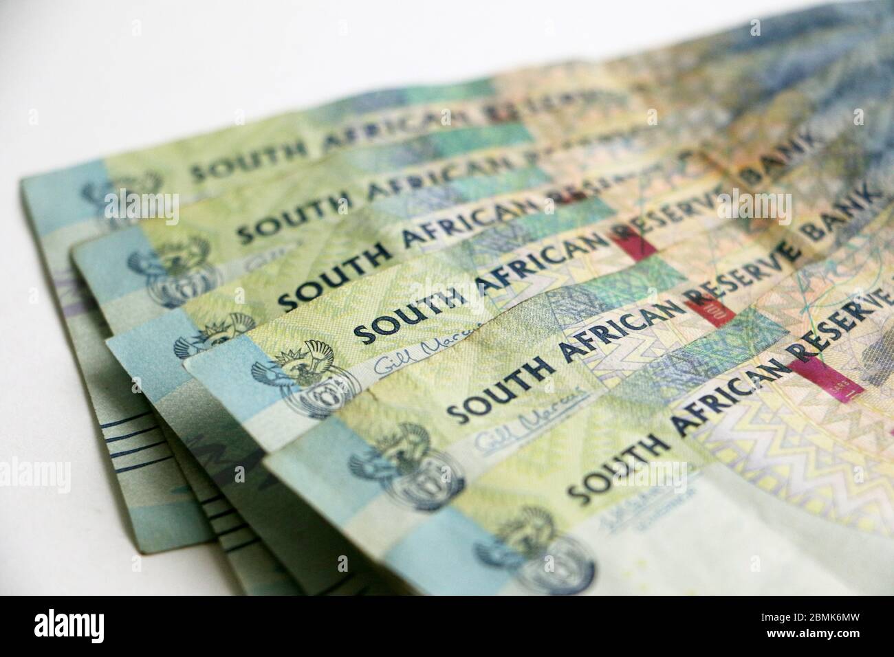 South African currency money rands notes scattered on white background Stock Photo