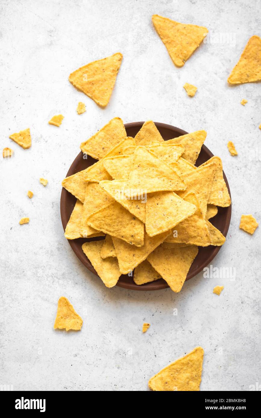 Mexican Corn Chips Nachos, top view, copy space. Tortilla or Nacho Chips for snack. Stock Photo