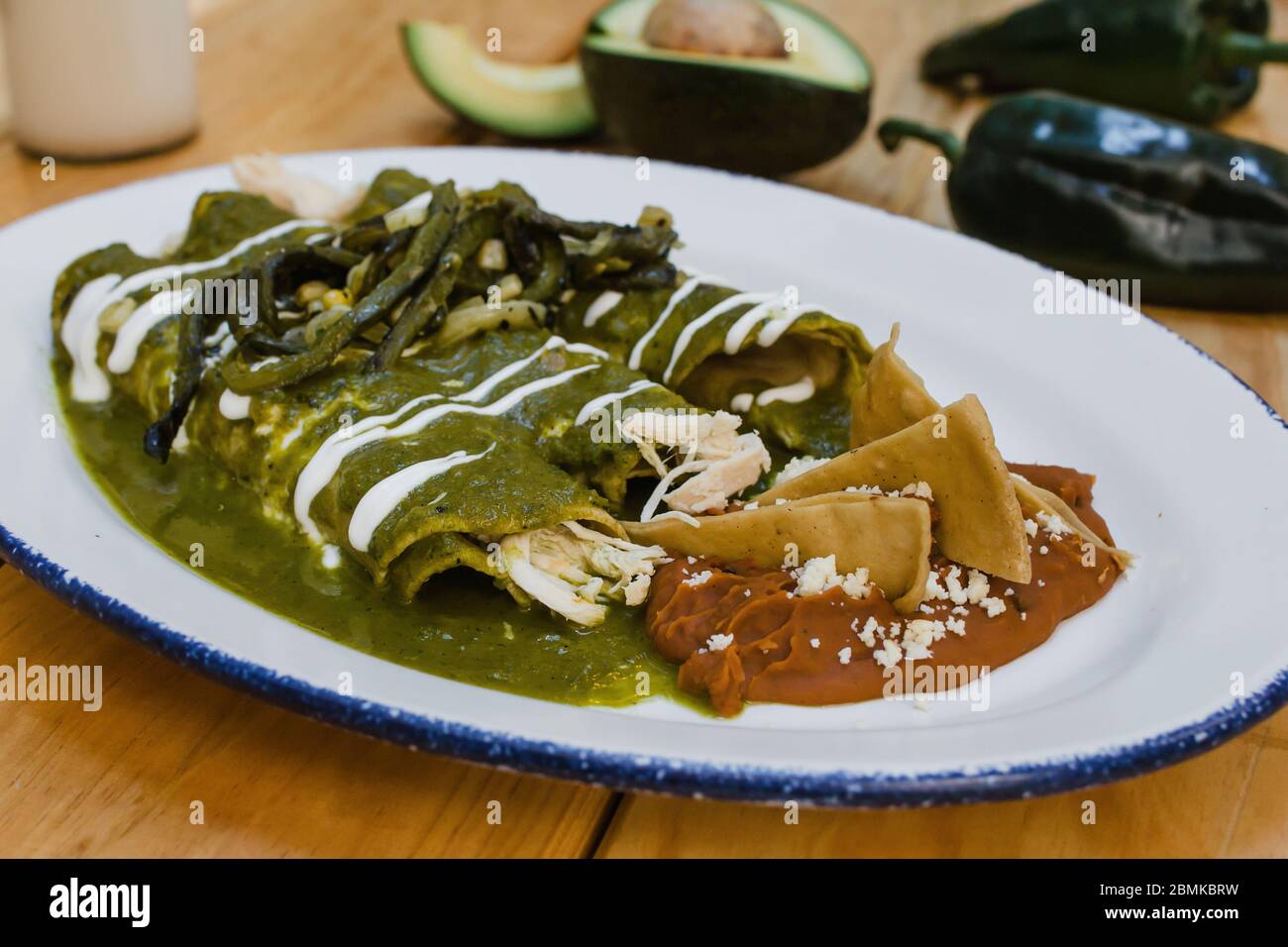 green enchiladas mexican food with tomato sauce and cheese in mexico Stock Photo