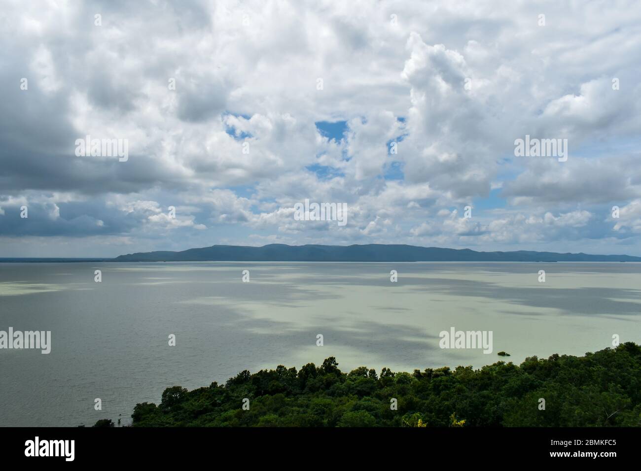 Daylight ocean mountain view with beautiful cloudy blue sky from island lighthouse Stock Photo