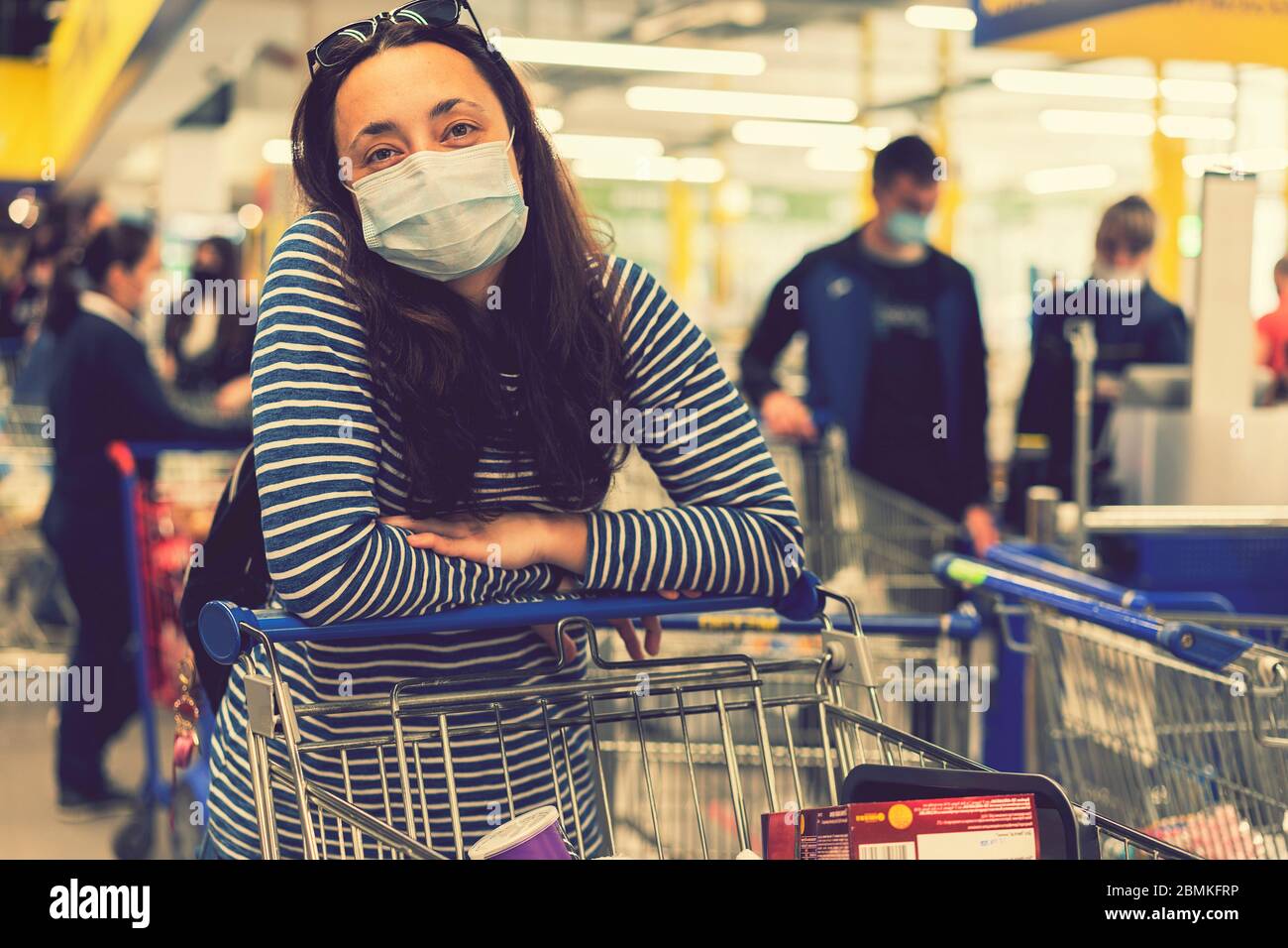 young woman wearing a hygiene protective mask over her face while