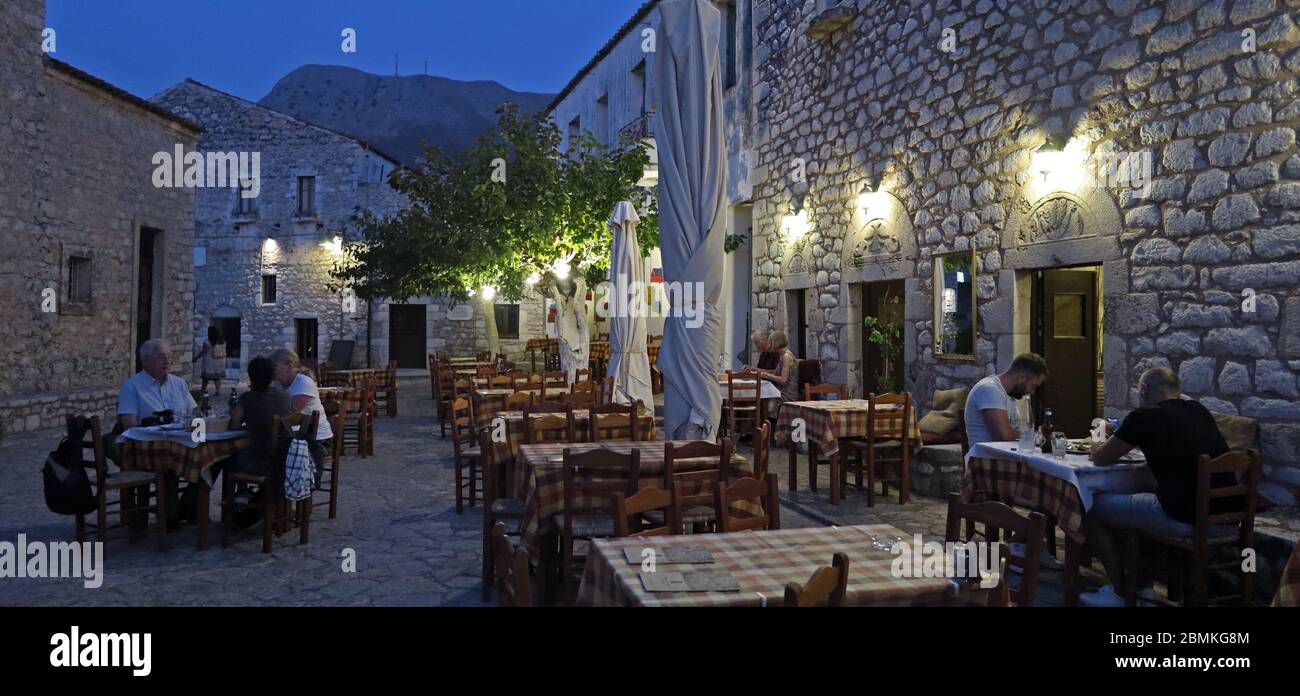 Outdoor dining in picturesque village of Areopoli, Mani, Greece Stock Photo