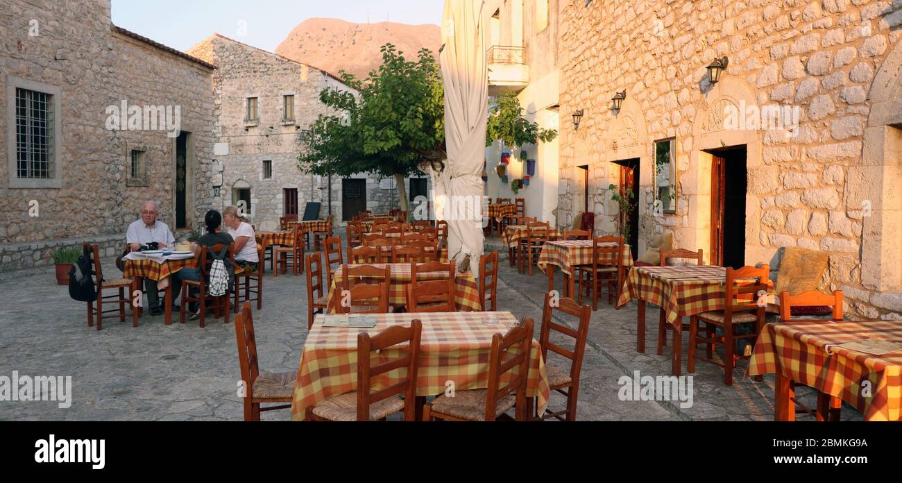 Outdoor dining in picturesque village of Areopoli, Mani, Greece Stock Photo