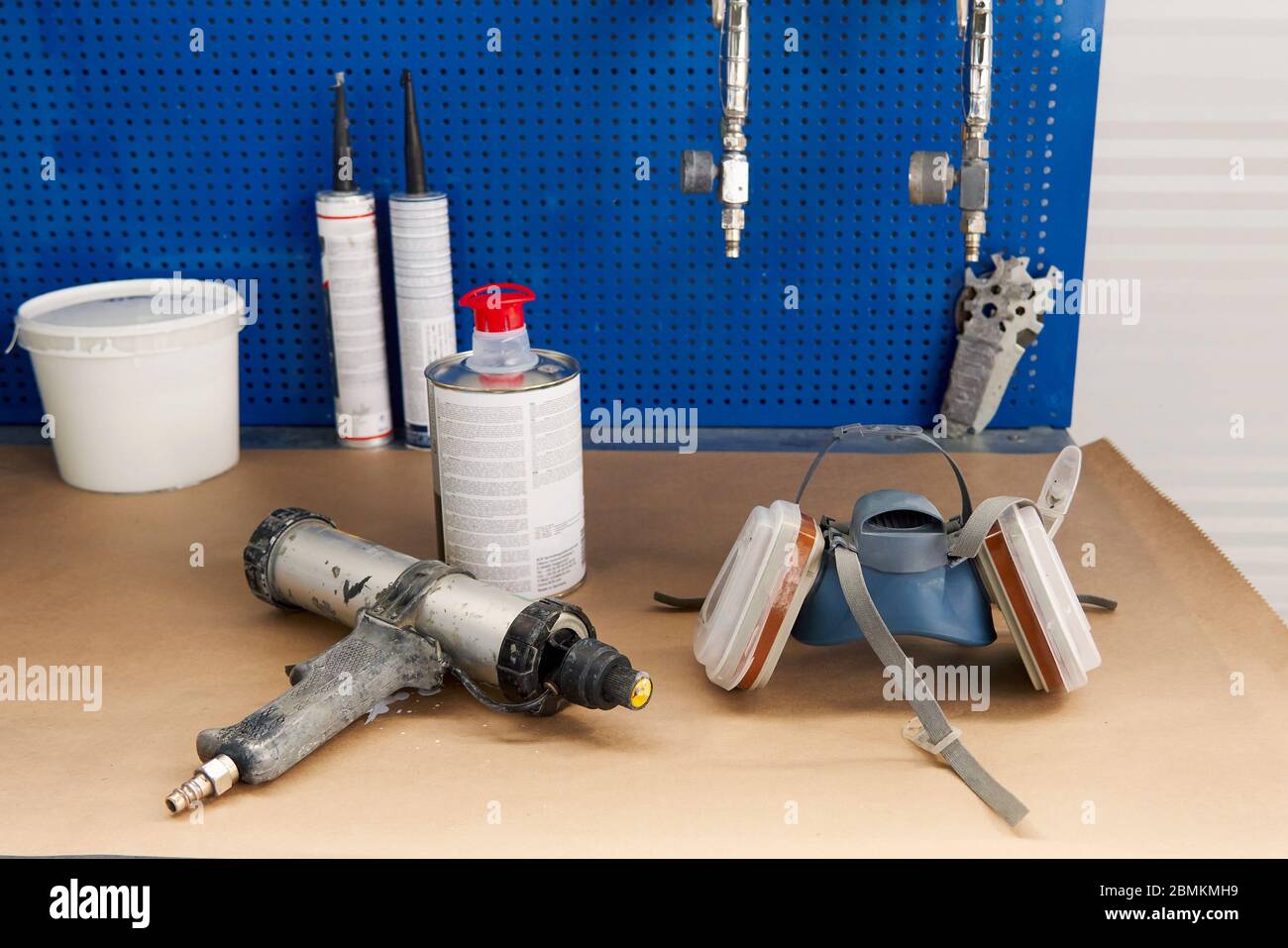airbrush for car painting, spray gun in auto repair shop Stock Photo