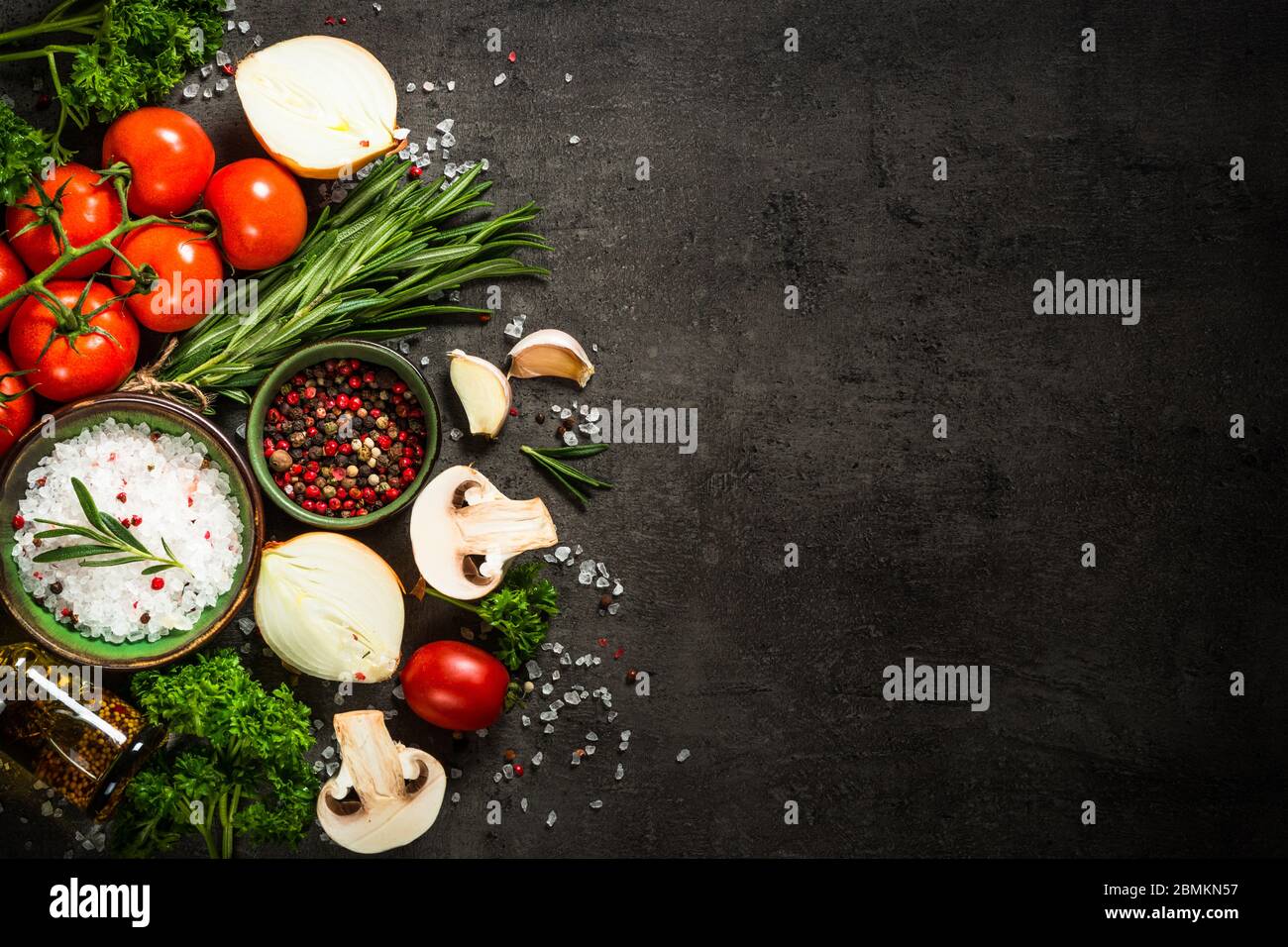 Food cooking background on black kitchen table Stock Photo - Alamy