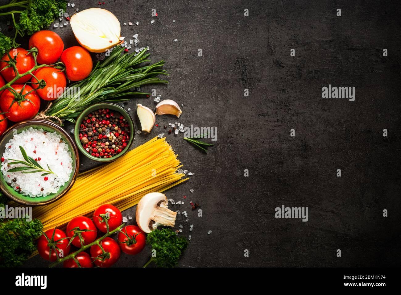 Food cooking background on black kitchen table Stock Photo Alamy