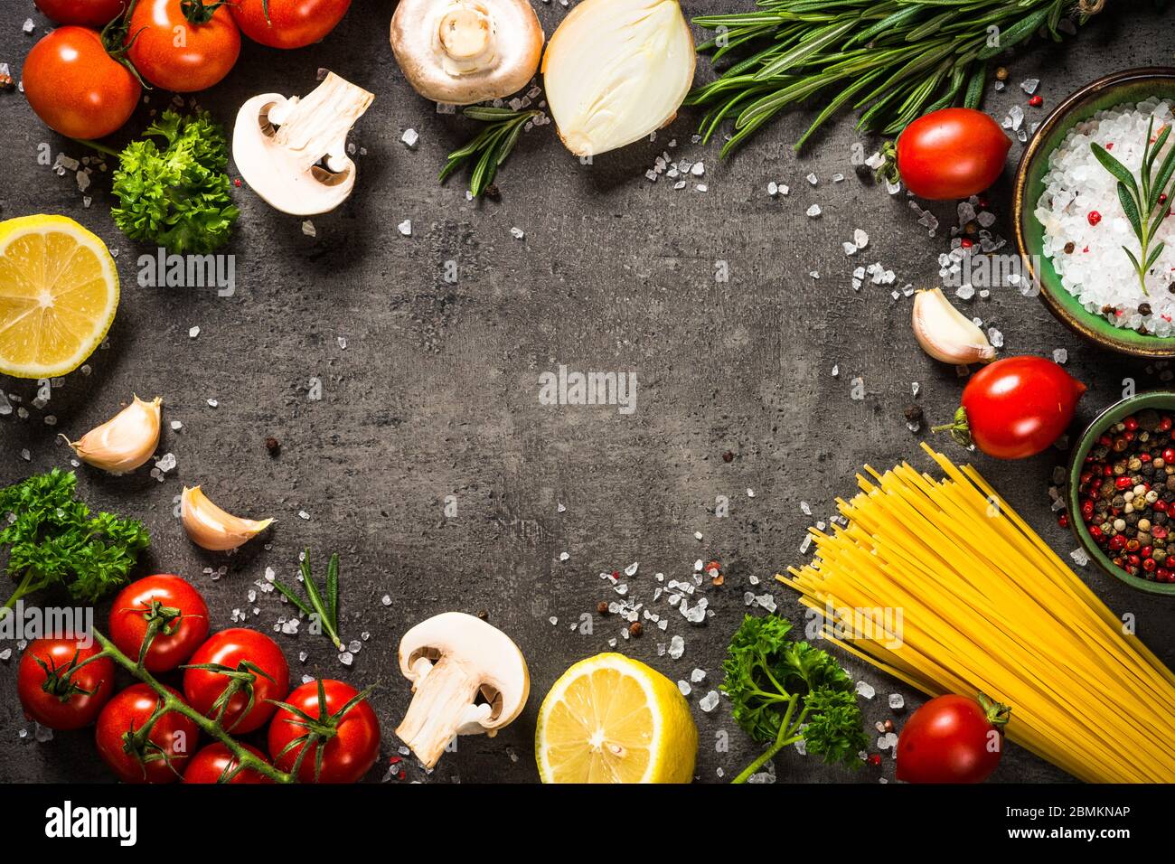 Food cooking background on black kitchen table Stock Photo Alamy
