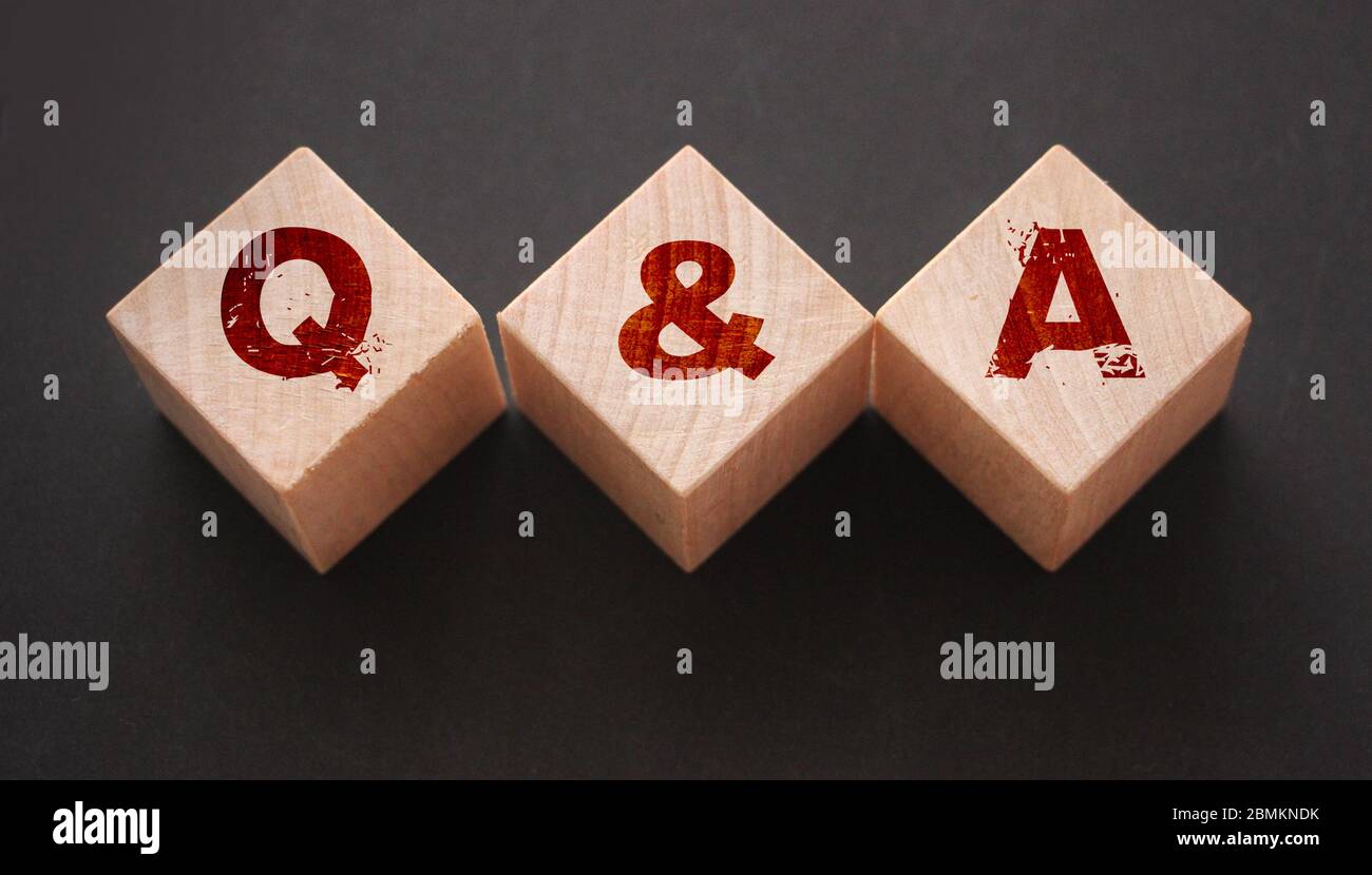 Q and A on wooden blocks Close-up Shot . Question and answers support ...