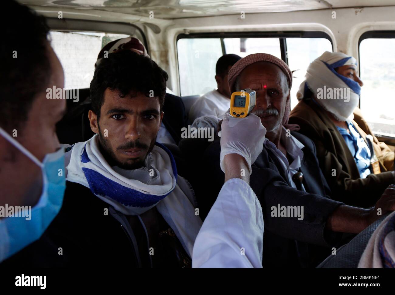 Sanaa, Yemen. 9th May, 2020. A health worker checks a traveler's body