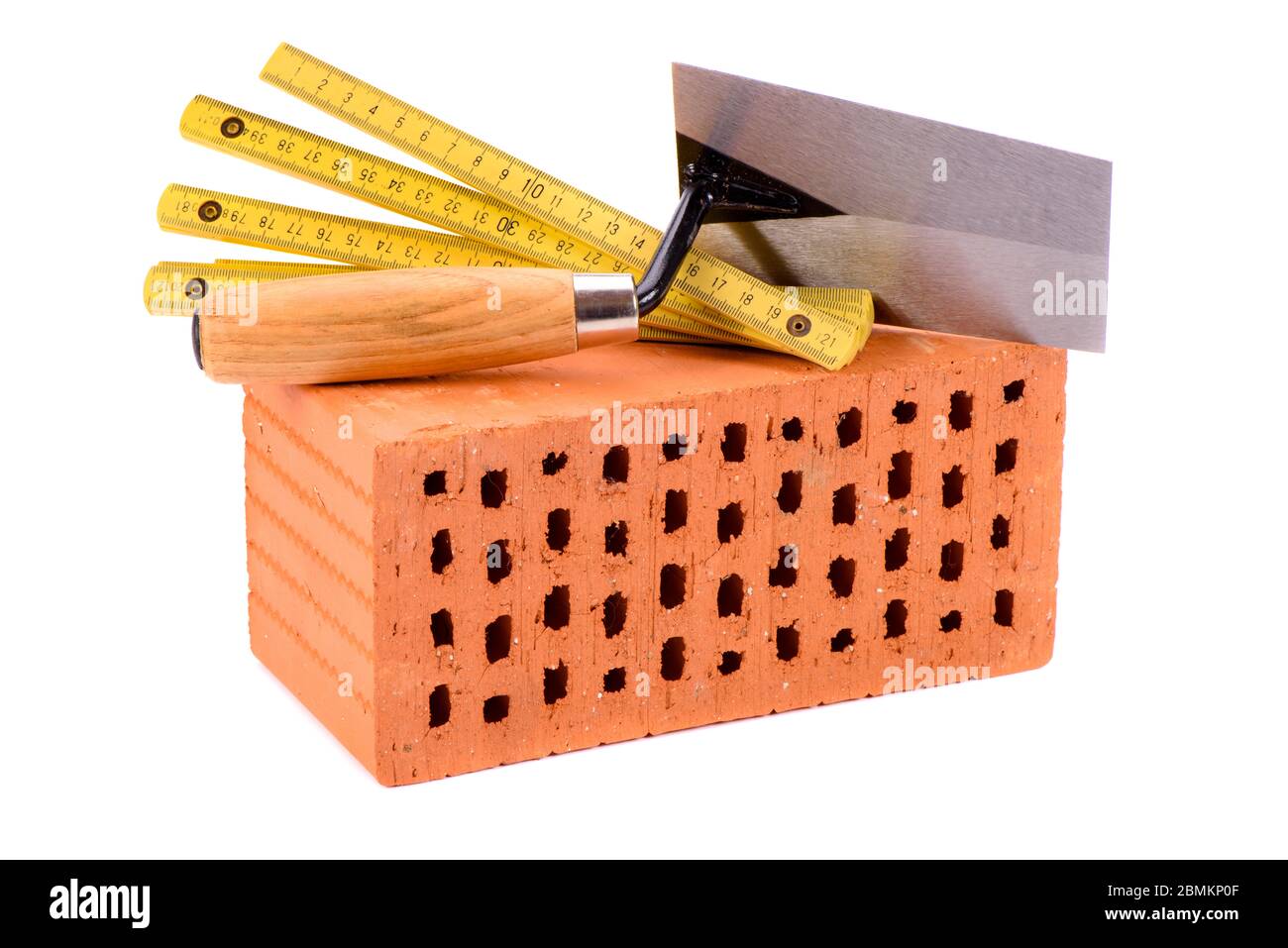 tools and brick as symbol for house construction Stock Photo