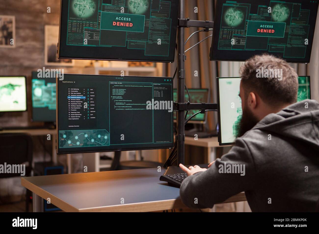 Bearded programmer hacking trying to steal information. Dangerous ...
