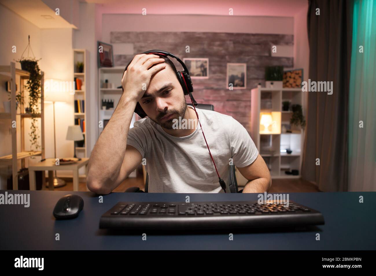 Pov of young man can't believe it's game over for him while playing online  shooter games Stock Photo - Alamy