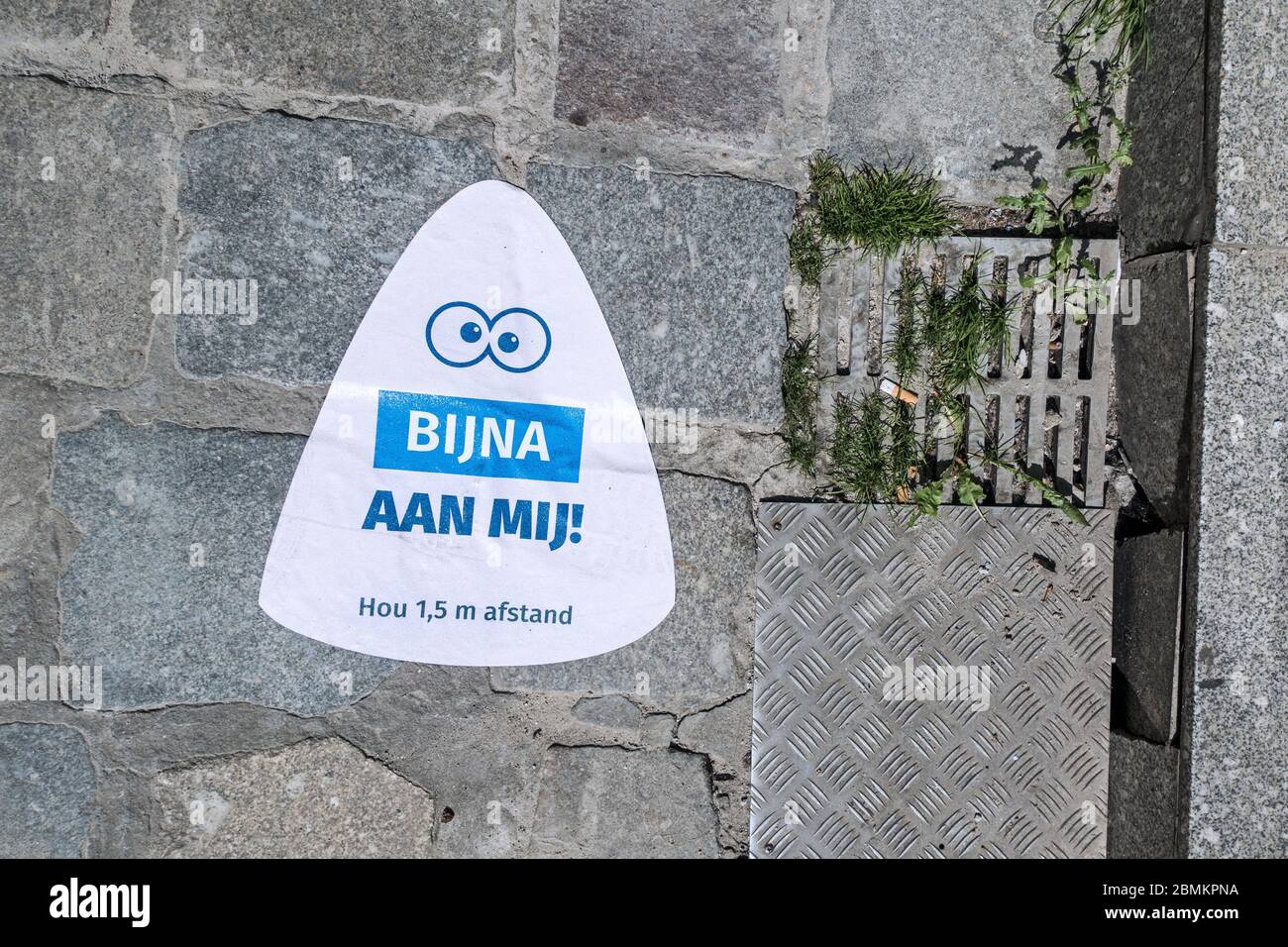 Sticker on pavement indicating to keep social distance of 1.5 metres during 2020 COVID-19 / coronavirus / corona virus pandemic, city Ghent, Belgium Stock Photo